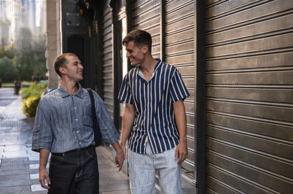A gay couple enjoys a leisurely walk, hand in hand, along the vibrant streets of Madrid. Their