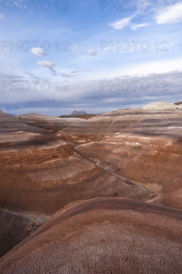 Panoramic view of Hanksville's bentonite hills in Utah, showcasing layers of vibrant earth tones