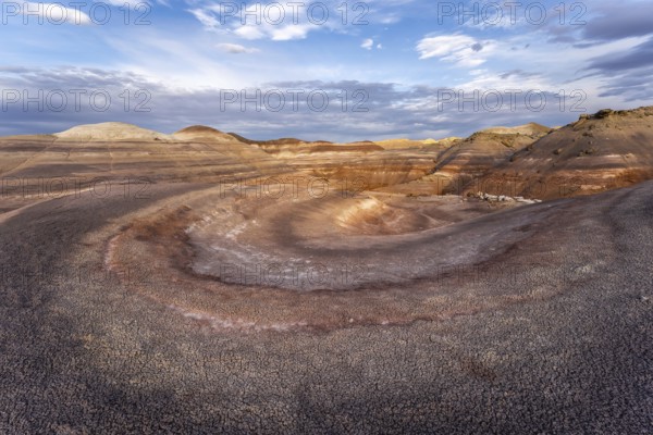 Dramatic aerial view of Hanksville Bentonite Hills in Utah, showcasing colorful, layered rock