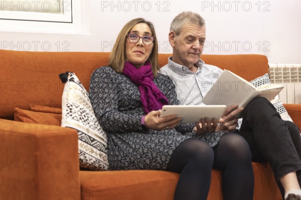 A couple with intellectual disabilities enjoys a evening indoors of a supervised home. The woman