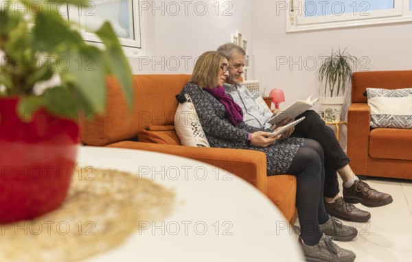 A couple with intellectual disabilities enjoys a relaxed time together in a supervised home,