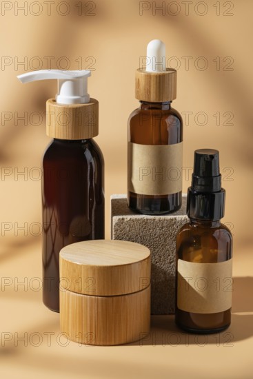 A collection of brown glass cosmetic bottles with wooden caps displayed on a beige background. The