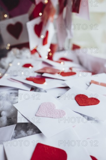 A romantic scene with Valentine's Day letters adorned with felt hearts. Soft lighting highlights