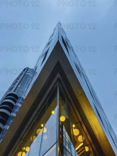 A striking view of a modern glass building in London's skyline, showcasing sharp angles and