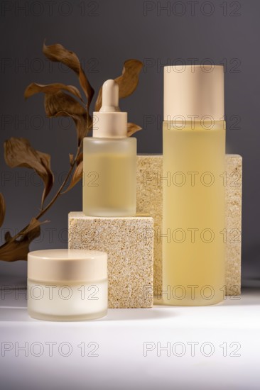 A collection of elegant skincare bottles and jars gracefully arranged on textured stone pedestals,