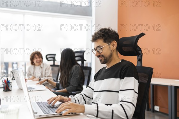 A vibrant office scene displaying coworkers engaged in teamwork, emphasizing collaboration and
