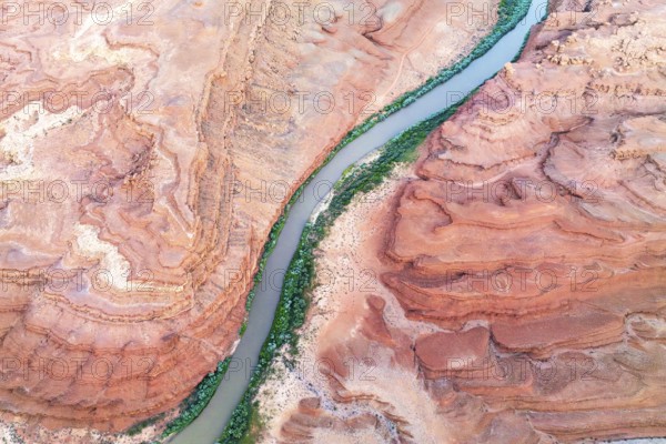 A stunning aerial shot of the Rio San Juan river weaving through the layered red rock formations in