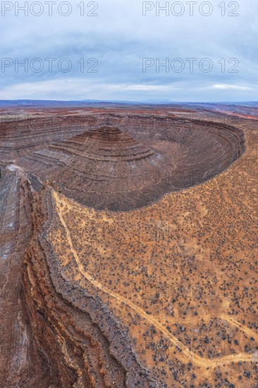 A breathtaking aerial view captures the intricate layers of a desert in San Juan canyon, showcasing