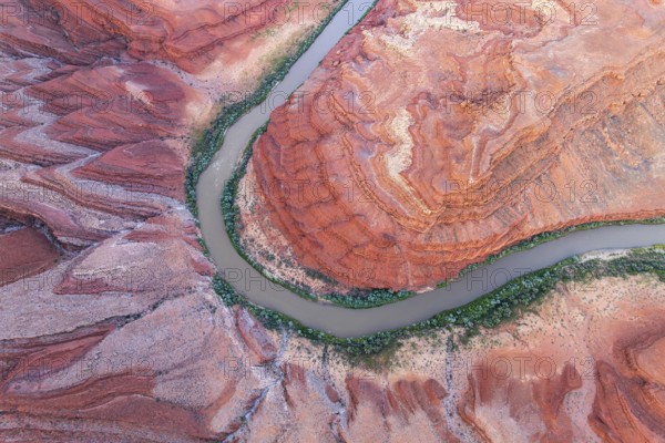 Aerial photograph of Rio San Juan meandering through the vibrant red rock formations and greenery