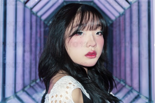 An Asian Gen Z girl with creative makeup explores a bright and vibrant arcade, embracing the lively