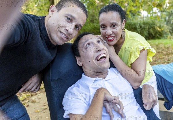 Spanish Cameroonian siblings enjoying a moment outdoors. The family shares a joyful connection,