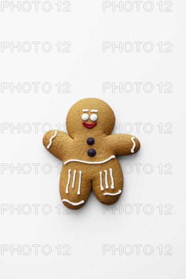 A charming gingerbread man cookie decorated with classic icing details on a white background