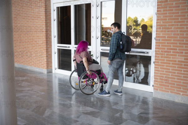 A college couple, with the woman using a wheelchair due to spina bifida, navigates campus They