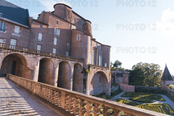 A stunning Berbie Palace exhibits grand architecture, with robust arches and detailed balconies in