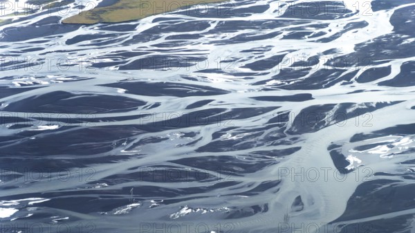 Stunning aerial photograph showcasing the intricate patterns and textures of meandering rivers
