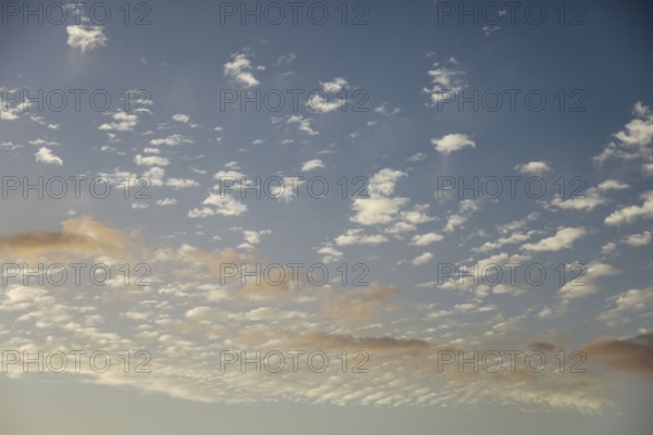 Soft scattered clouds in the sky during dusk. The pastel colors create a dreamy and tranquil