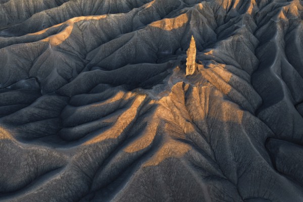 A striking aerial view of the textured terrain of Caineville Mesa near Hanksville, Utah, bathed in