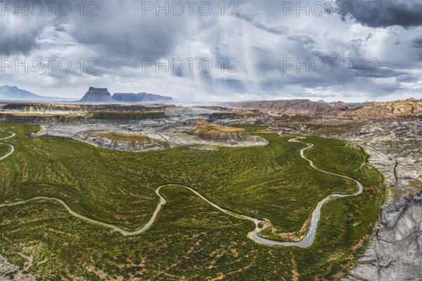 Overhead drone shot capturing the expansive and rugged terrain of Hanksville, Utah, featuring