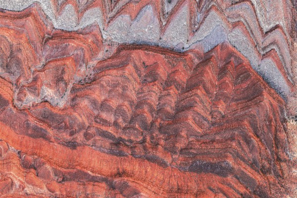 Striking aerial image capturing the rich, red and gray patterns of rock formations along the San