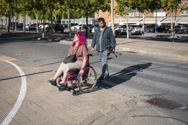 A couple navigates college life, highlighting inclusivity and diversity The woman, using a