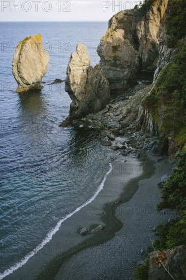 A breathtaking coastal view of Sherwink, Trinity, Newfoundland capturing the waves gently lapping