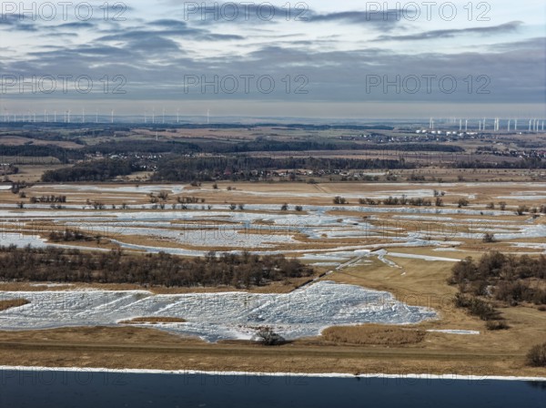 Ice and snow-covered foothills of the Oder in the Lower Oder Valley National Park. aerial view.