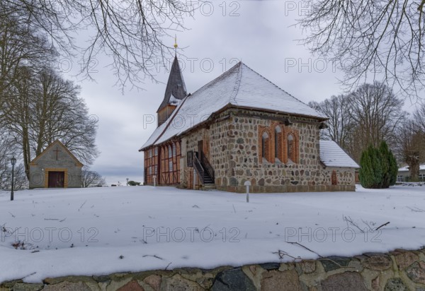 Lassahn village church in the snow in the Schaalsee UNESCO Biosphere Reserve. Lassahn,