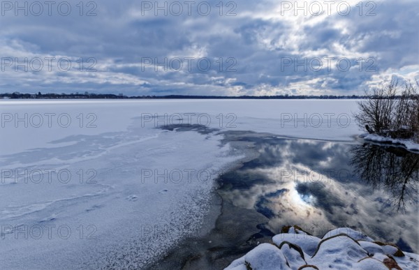 View of Schaalsee, covered with ice and snow, on the bridge tour, a hiking trail around Lake