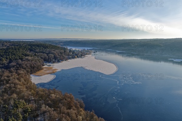 Lake Werbellin in the UNESCO Schorfheide-Chorin Biosphere Reserve with ice rinks in winter. aerial