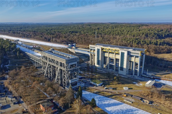 Niederfinow boat lift on the Oder-Havel Canal in winter with ice on the canal. aerial view.