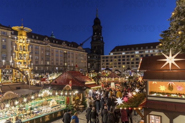 Large pyramid at the Striezelmarkt Christmas market on the Altmarkt in Dresden, in the background