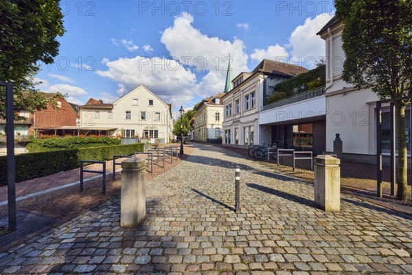 Pedestrian zone, barrier bollard, general development, houses, residential buildings and commercial