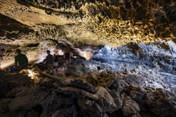 Underground cave formed by lava flow, visitors in illuminated lava cave, Cueva de los Verdes,
