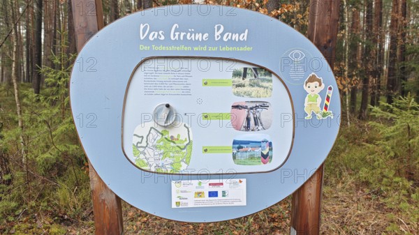 Information sign about the Green Belt in a wooded area, hiking on the former inner-German border on