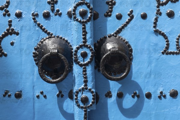 Detail of beautiful blue ornate door in the narrow streets of Tunis Medina, the historical Kasbah