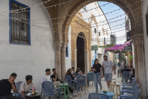 Tunis, Tunisia. 29th May 2024 Young Tunisians and tourists enjoy the café culture in the alleyways