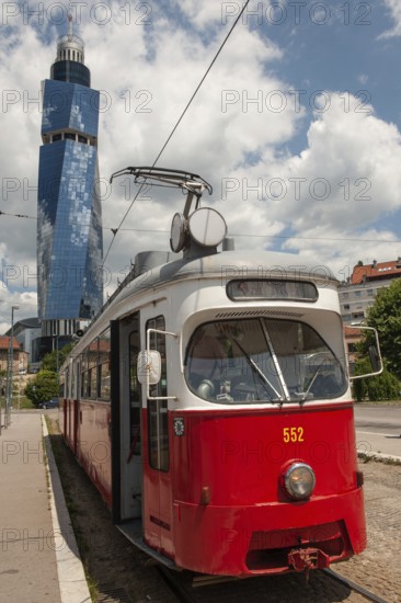 Sarajevo, Bosnia and Herzegovina July 25th 2019. An old tram waits at a tram stop with the Avaz