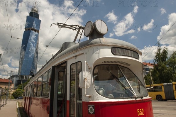 Sarajevo, Bosnia and Herzegovina July 25th 2019. An old tram waits at a tram stop with the Avaz