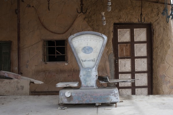 Siwa, Egypt, April 15th 2018 A dusty set of scales outside a closed shop in the Egyptian Oasis town
