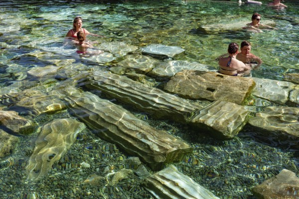 Pamukkale, Turkey, April 25th 2020 Foreign tourists enjoys the healing properties of thermal waters