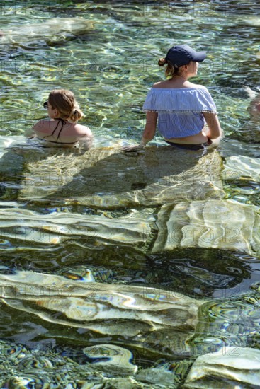 Pamukkale, Turkey, April 25th 2020 Foreign tourists enjoy the healing properties of thermal waters