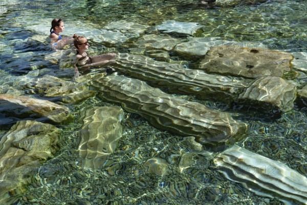Pamukkale, Turkey, April 25th 2020 Foreign tourists enjoy the healing properties of thermal waters
