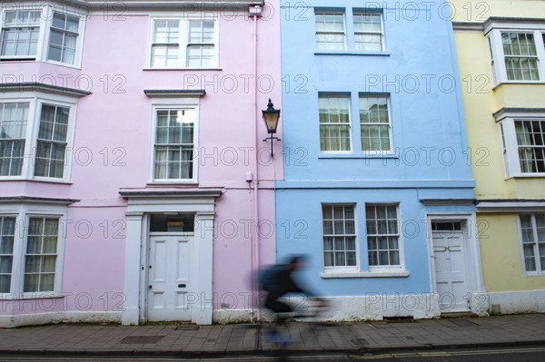 Oxford, England, UK. February 2nd, 2020 An Oxford university student cycles along Hollywell Street,
