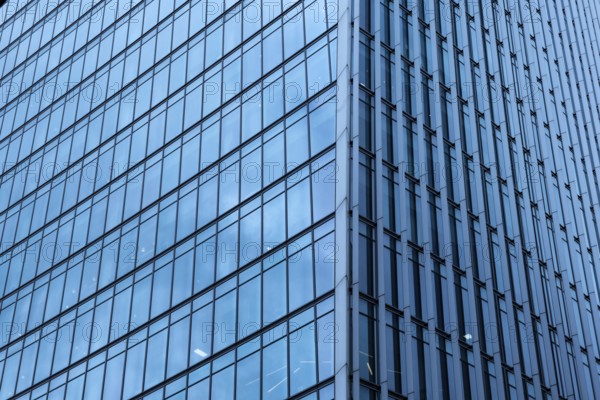 Modern abstract reflections in glass fronted commercial office buildings in the financial district