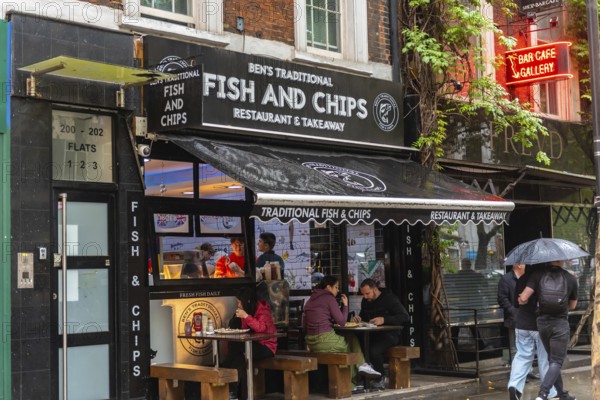 London, United Kingdom. August 2nd 2023 Traditional British Fish and Chip Shop in the rain, famous