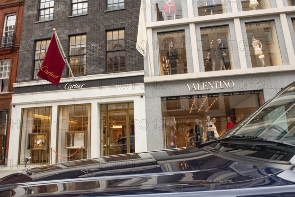 United Kingdom. August 2nd 2023 A Rolls Royce Bentley parked in front of Cartier and Valentino
