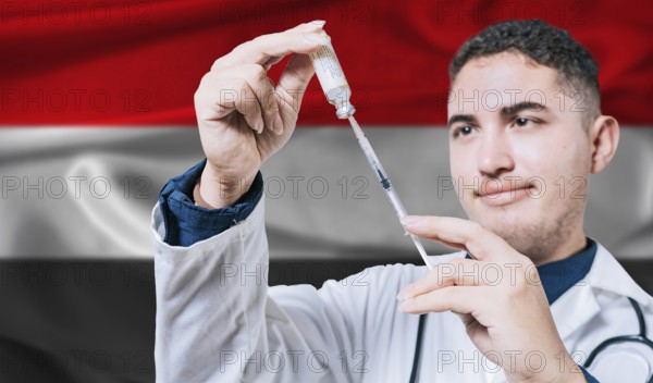 Doctor holding syringe on Yemen flag background. Medical professional holding syringe with Yemeni