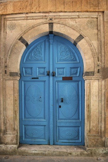 Detailed blue ornate design of a typical door in the Medina of Tunis, a UNESCO designated quarter