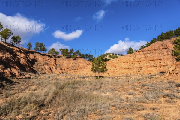 Las arcillas natural park in teruel shows vivid red clay badlands and eroded canyons topped with