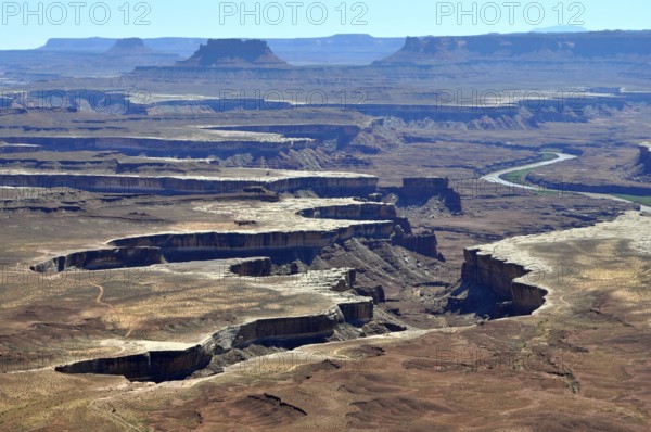 Sublime canyon landscape with river, formed by erosion, under clear sky, Canyonlands National Park,